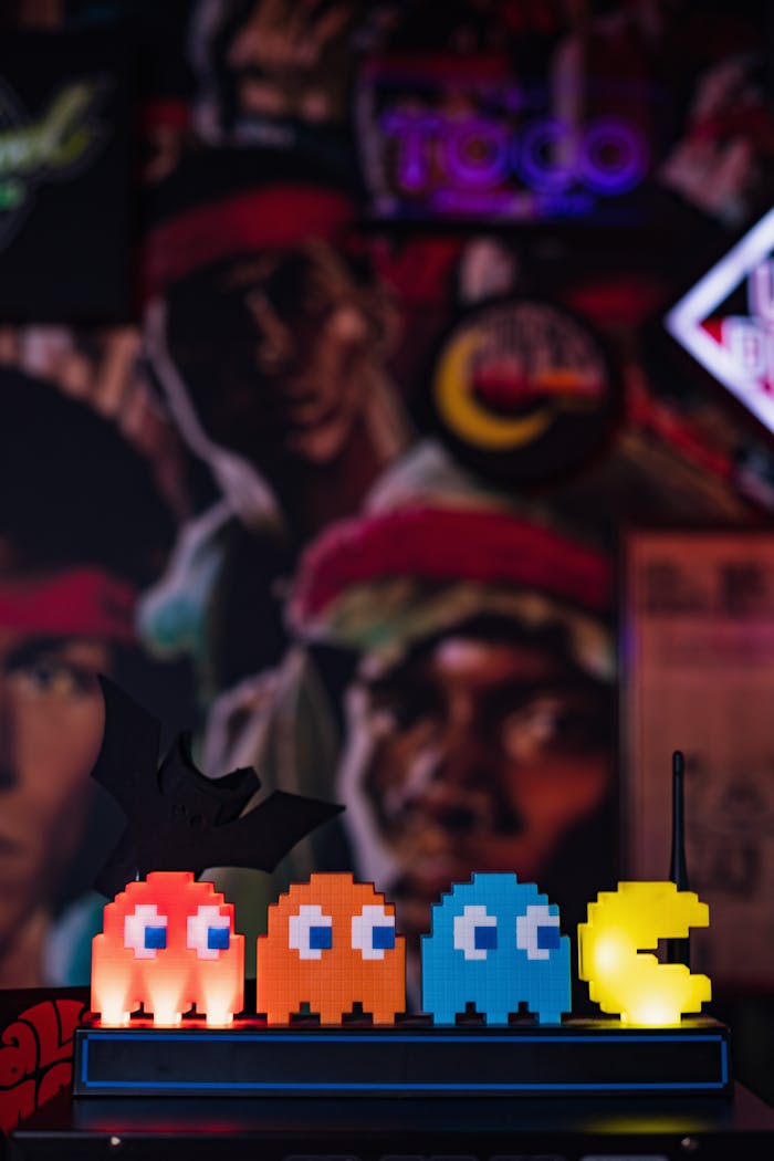 Retro Pac-Man figures illuminated in vibrant colors against a nostalgic backdrop.